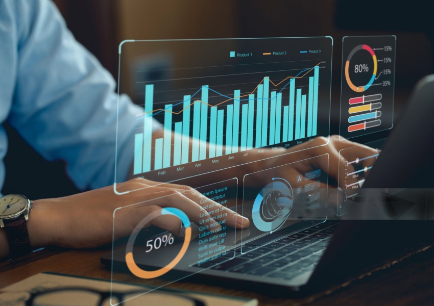 Analyst Works on Personal Computer Showing business analytics dashboard with charts, metrics and KPI to analyze performance and create insight reports for operations management. Data analysis concept.